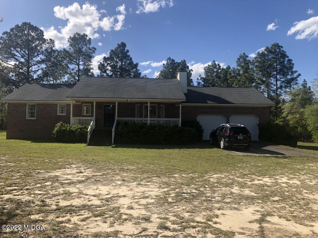 1589 Hamlin Road Lizella, GA 31052 - Photo 24 of 25 a view of a house with a yard