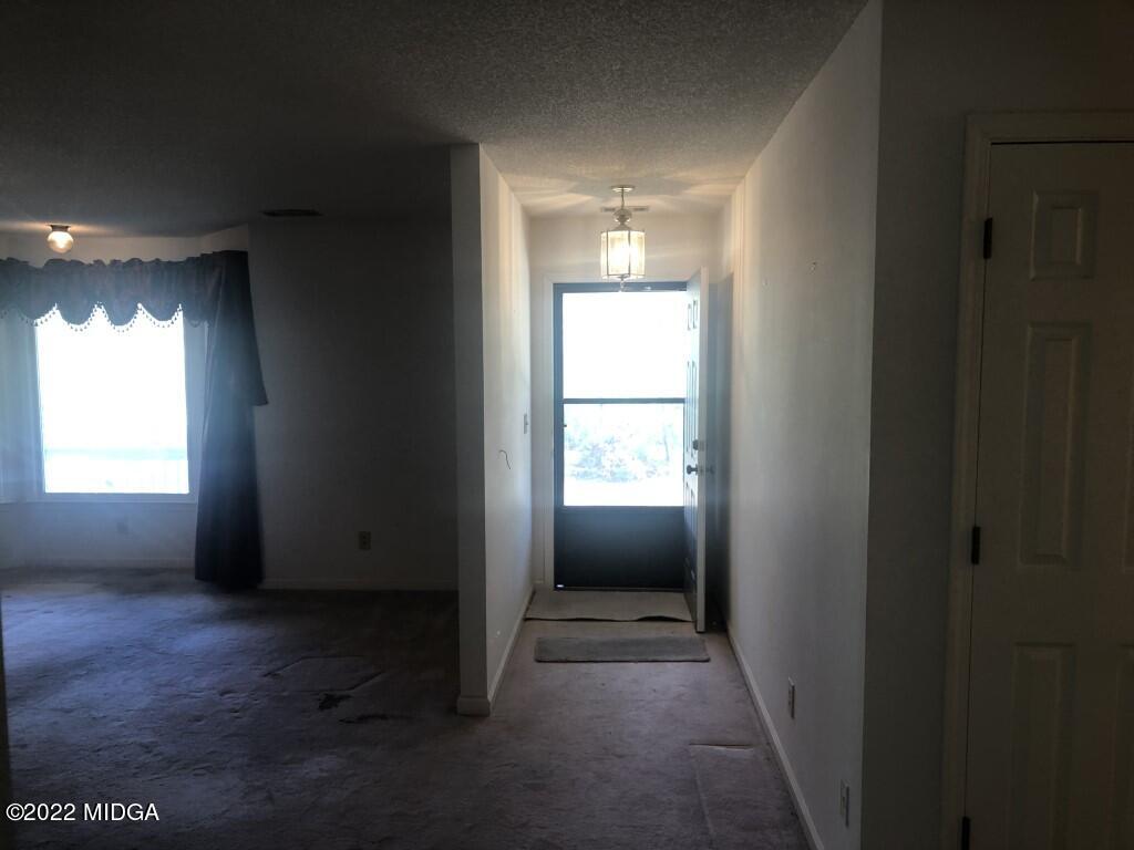 1589 Hamlin Road Lizella, GA 31052 - Photo 7 of 25 a view of empty room with window