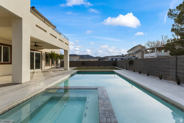 226 East 1100 North Hurricane, UT 84737 - Photo 31 of 49 Integrated pool / spa featuring a patio area, a fenced backyard, and a residential view