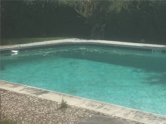 a view of a big yard with a large tree