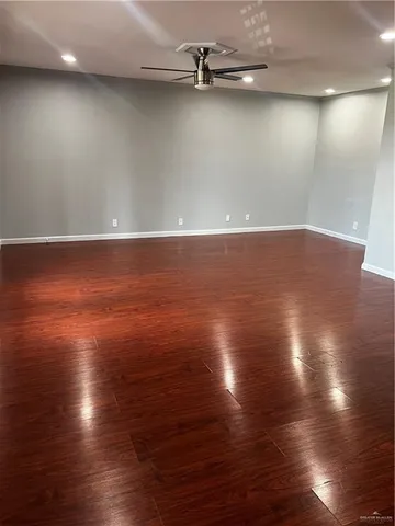 a view of room with wooden floor