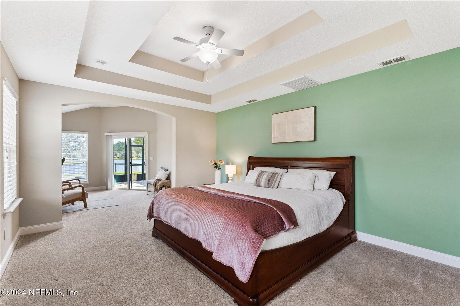 273 Parkwood Circle St. Augustine, FL 32086 - Photo 18 of 34 a large bedroom with bed and window