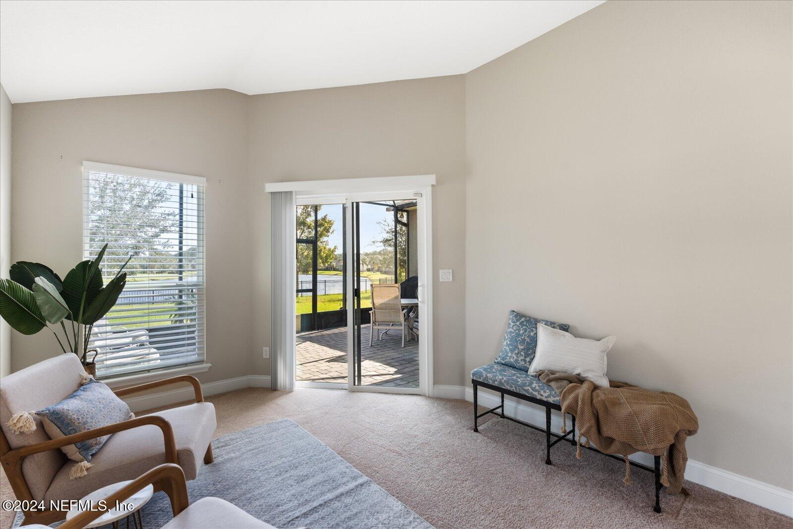 273 Parkwood Circle St. Augustine, FL 32086 - Photo 19 of 34 a living room with furniture and a potted plant
