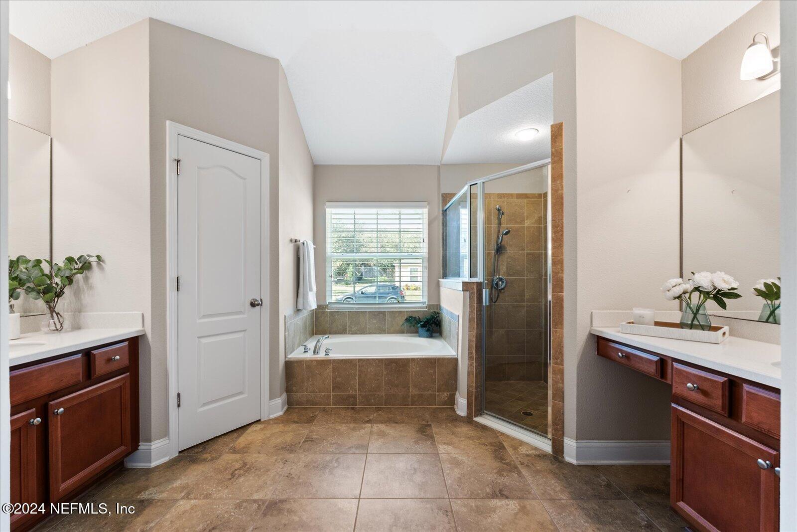 273 Parkwood Circle St. Augustine, FL 32086 - Photo 20 of 34 a bathroom with a tub shower and sink