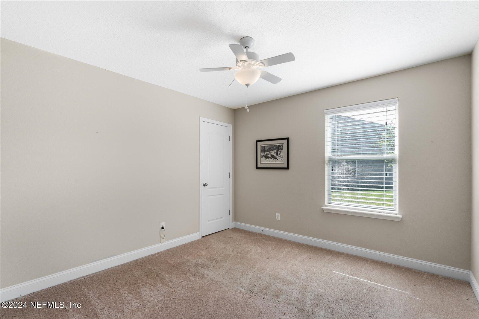 273 Parkwood Circle St. Augustine, FL 32086 - Photo 22 of 34 a view of an empty room with a window