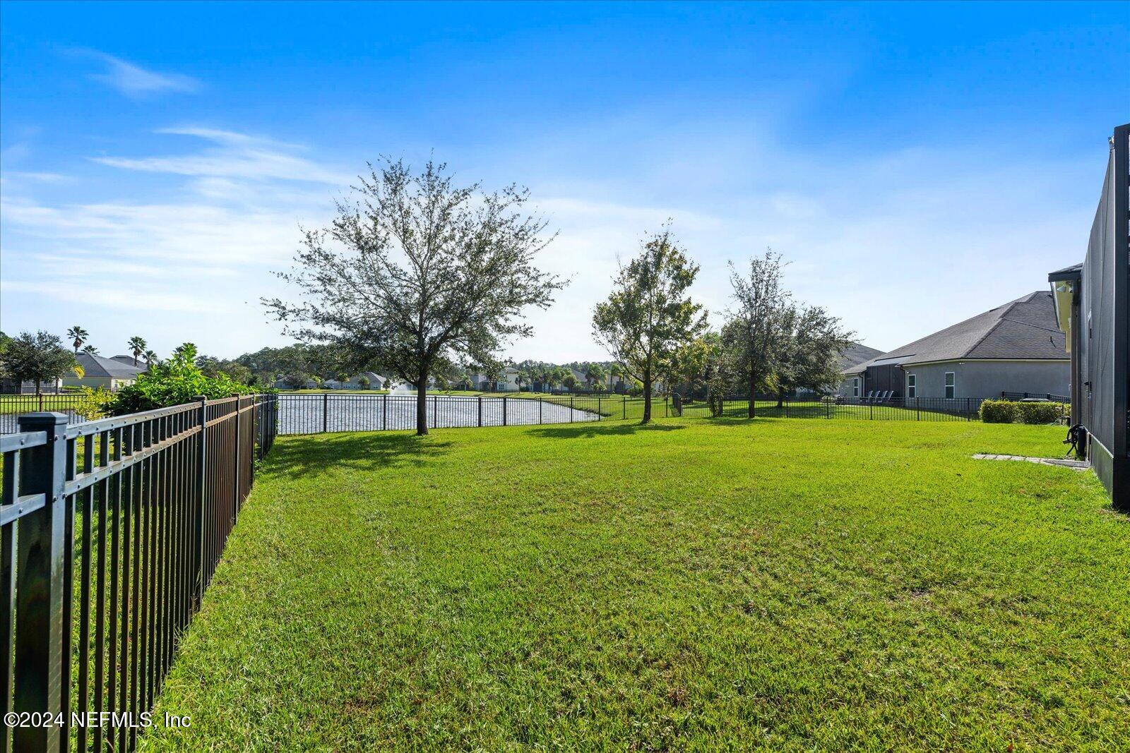 273 Parkwood Circle St. Augustine, FL 32086 - Photo 25 of 34 a view of a deck with a big yard