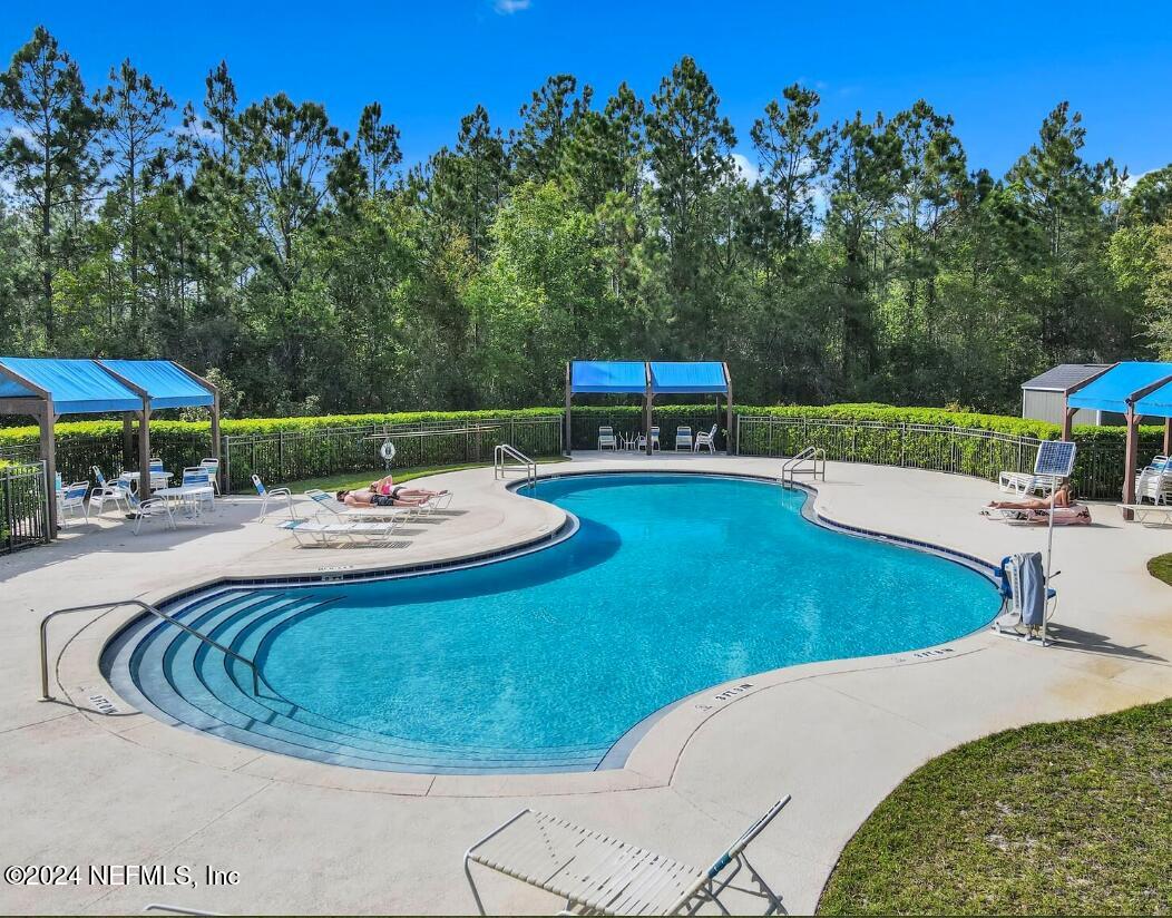 273 Parkwood Circle St. Augustine, FL 32086 - Photo 29 of 34 a view of a swimming pool with a patio