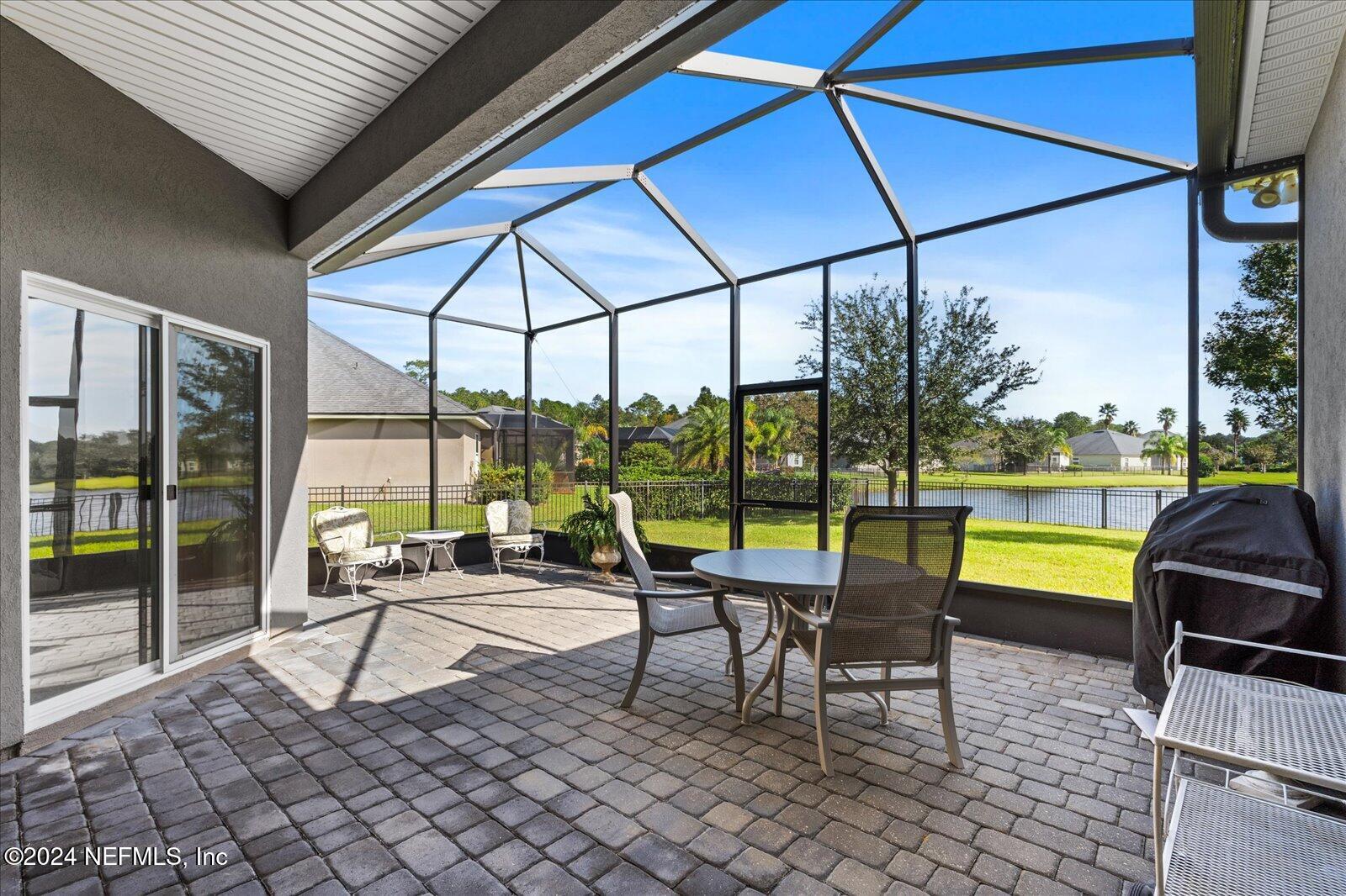 273 Parkwood Circle St. Augustine, FL 32086 - Photo 5 of 34 a building outdoor space with patio furniture and swimming pool