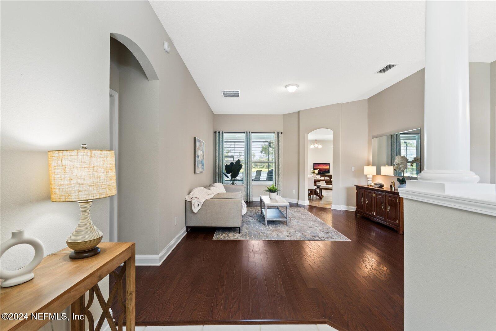 273 Parkwood Circle St. Augustine, FL 32086 - Photo 7 of 34 a living room with furniture and a table