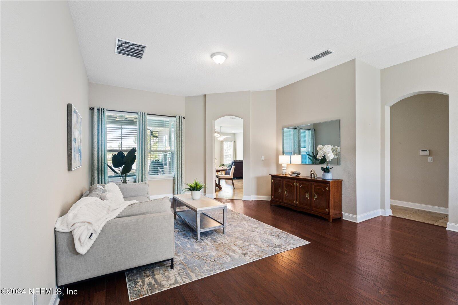 273 Parkwood Circle St. Augustine, FL 32086 - Photo 8 of 34 a living room with furniture fireplace and a wooden floor