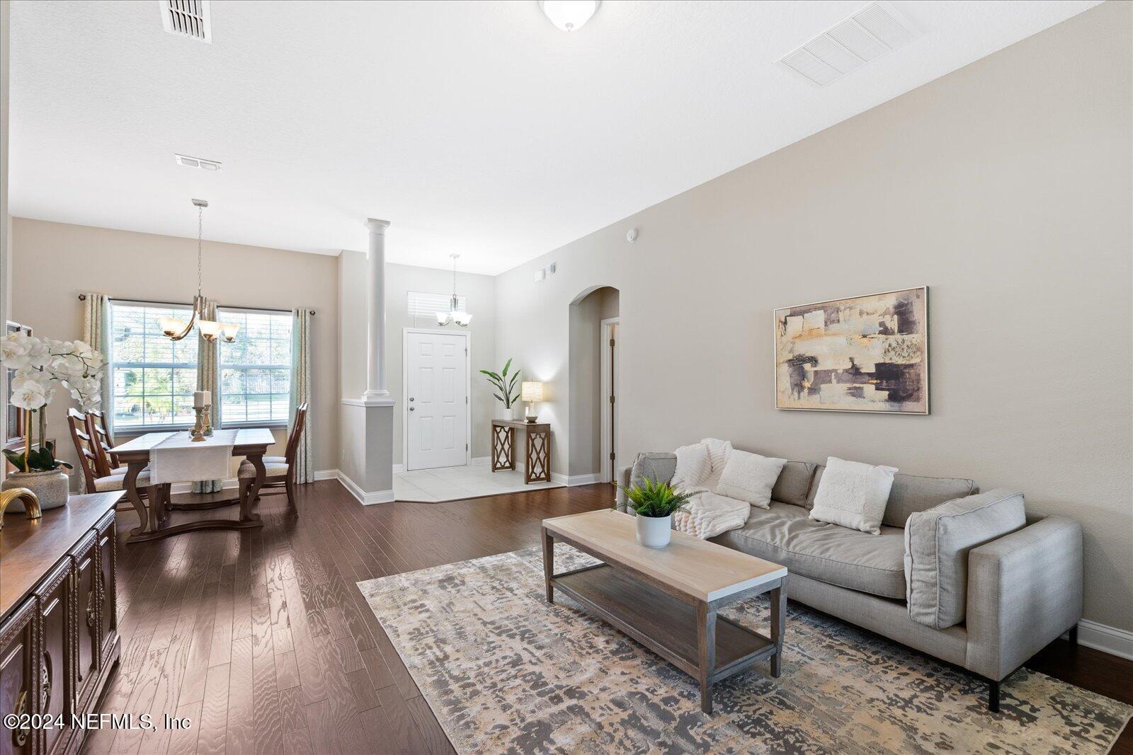 273 Parkwood Circle St. Augustine, FL 32086 - Photo 9 of 34 a living room with furniture and wooden floor