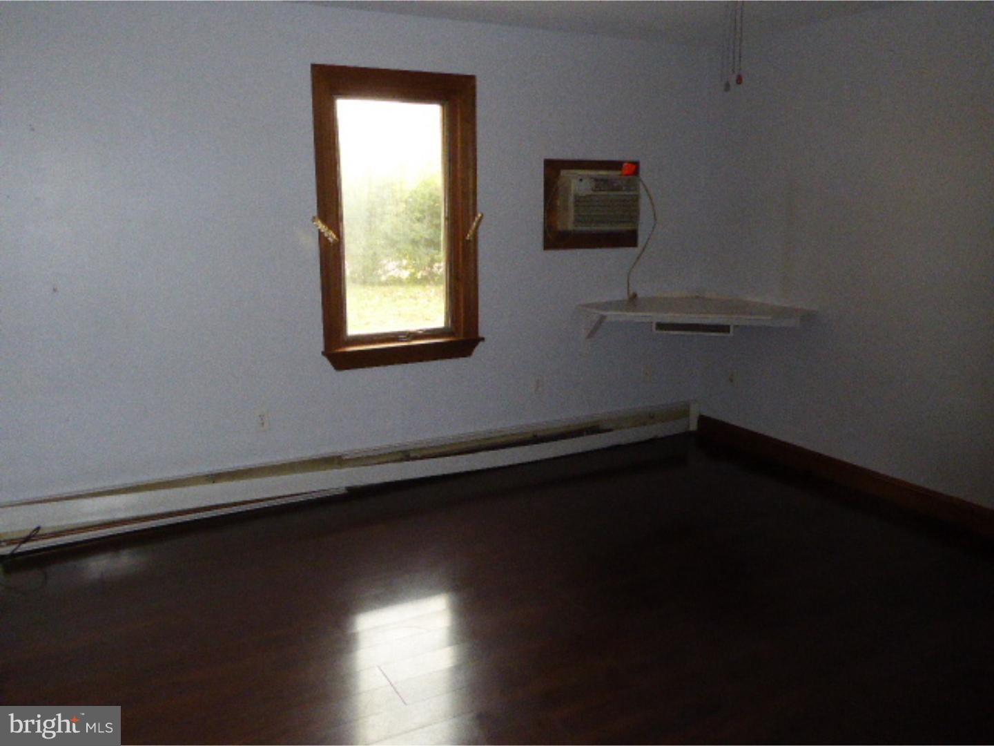 98 Ridge Road Phoenixville, PA 19460 - Photo 8 of 12 a view of a livingroom with wooden floor and a window
