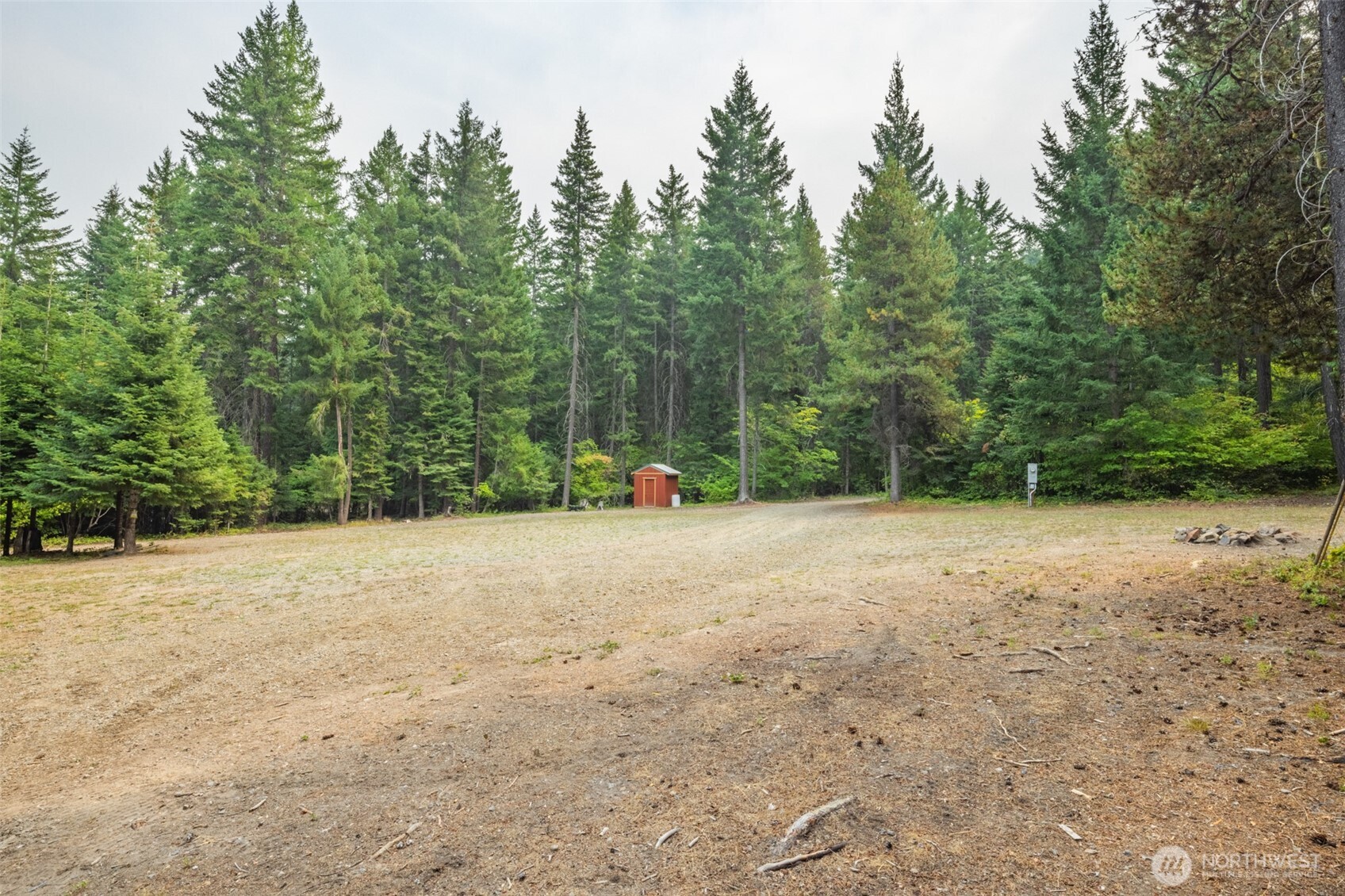 1850 Timber Mountain Loop Cle Elum, WA 98922 - Photo 25 of 32 a view of a field with trees in the background