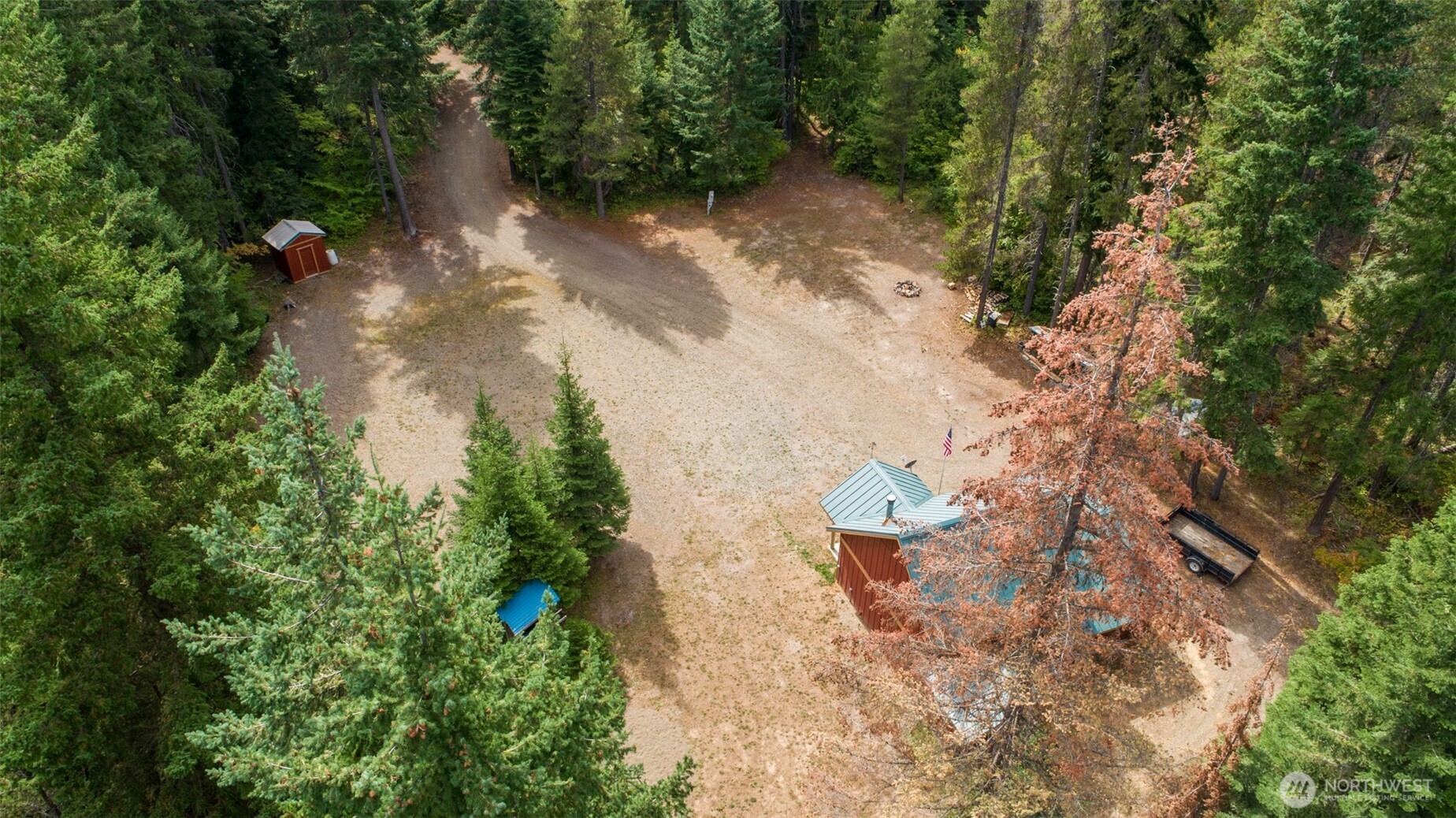 1850 Timber Mountain Loop Cle Elum, WA 98922 - Photo 30 of 32 an aerial view of a house with a yard and large trees