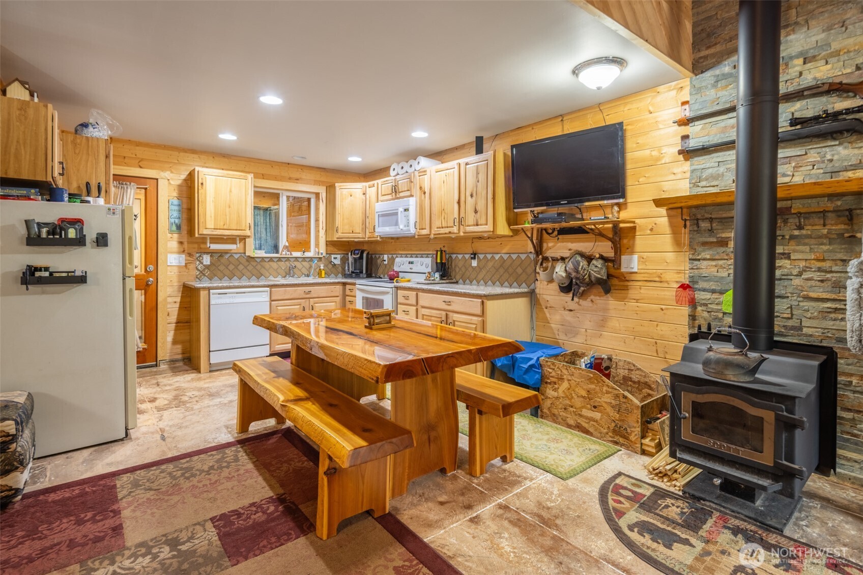 1850 Timber Mountain Loop Cle Elum, WA 98922 - Photo 3 of 32 a kitchen with stainless steel appliances kitchen island granite countertop a sink and cabinets