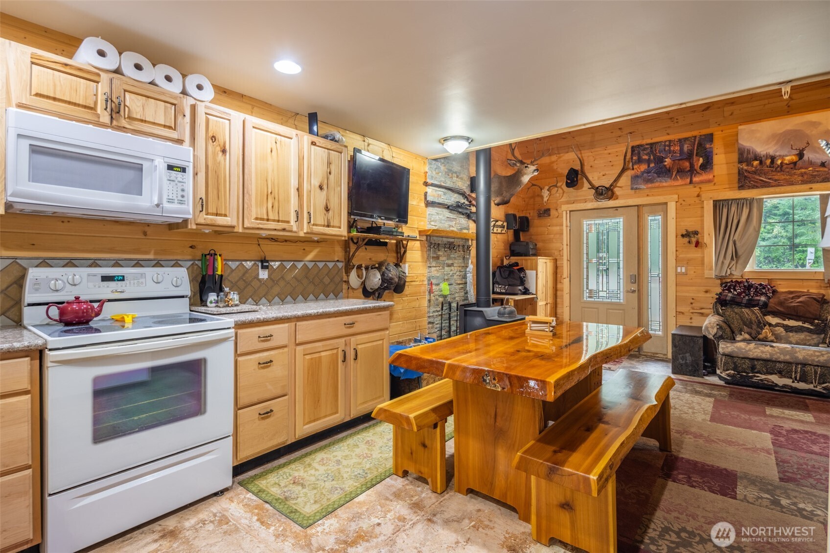 1850 Timber Mountain Loop Cle Elum, WA 98922 - Photo 5 of 32 a kitchen with stainless steel appliances granite countertop a stove a sink and a refrigerator