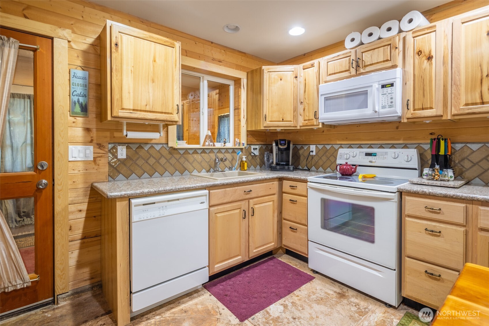 1850 Timber Mountain Loop Cle Elum, WA 98922 - Photo 7 of 32 a kitchen with granite countertop a sink stainless steel appliances and cabinets