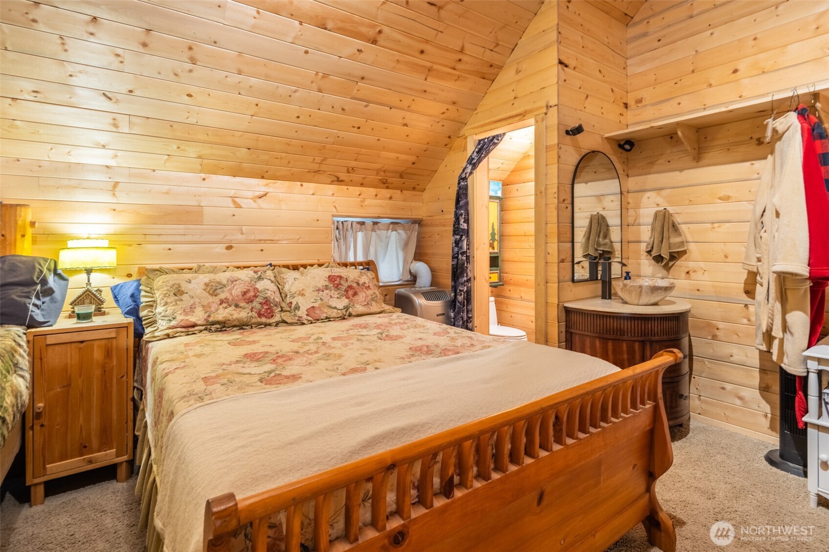1850 Timber Mountain Loop Cle Elum, WA 98922 - Photo 9 of 32 a large bed sitting in a room next to a bathroom