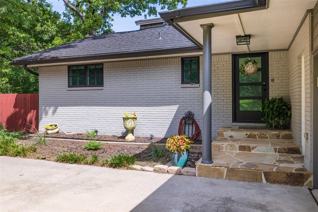 205 Timberlake Drive Azle, TX 76020 - Photo 4 of 40 a front view of a house with a yard
