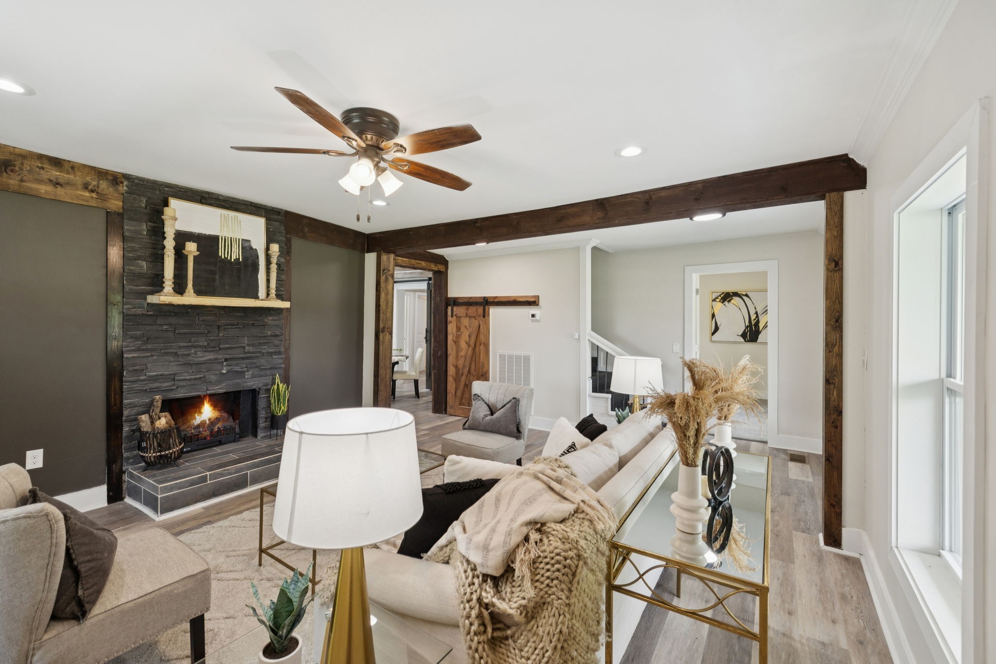 a view of a livingroom with furniture and a fireplace