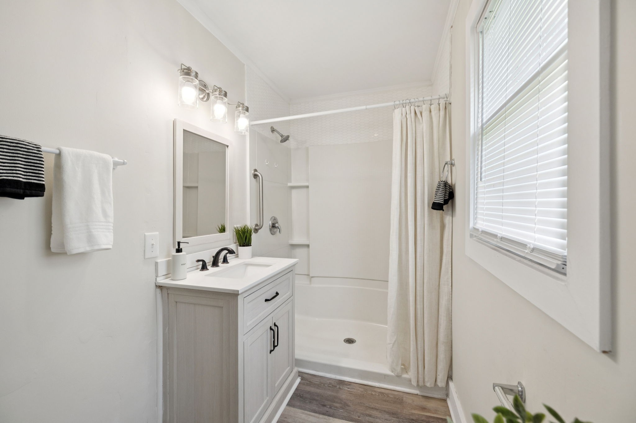 511 North Main Street Morrison, TN 37357 - Photo 24 of 41 a bathroom with a sink a mirror and a shower