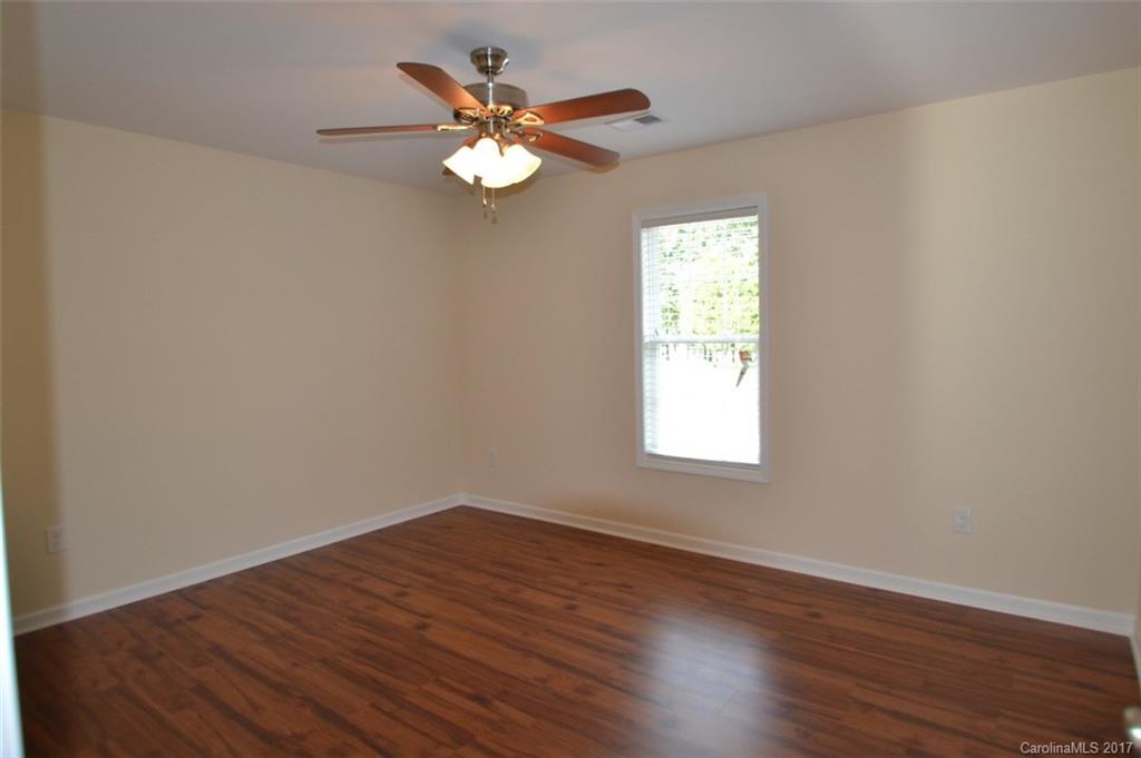 3835 Lee Moore Road, Unit 3835 Maiden, NC 28650 - Photo 12 of 19 wooden floor in an empty room with a window