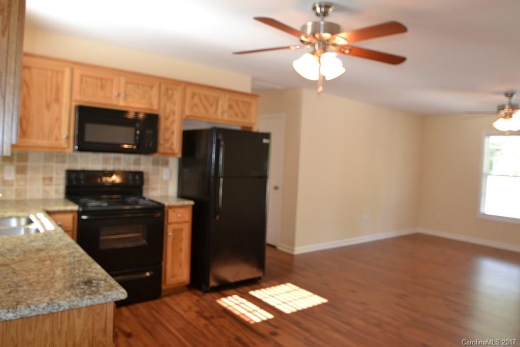 3835 Lee Moore Road, Unit 3835 Maiden, NC 28650 - Photo 10 of 19 a kitchen with a refrigerator stove and microwave