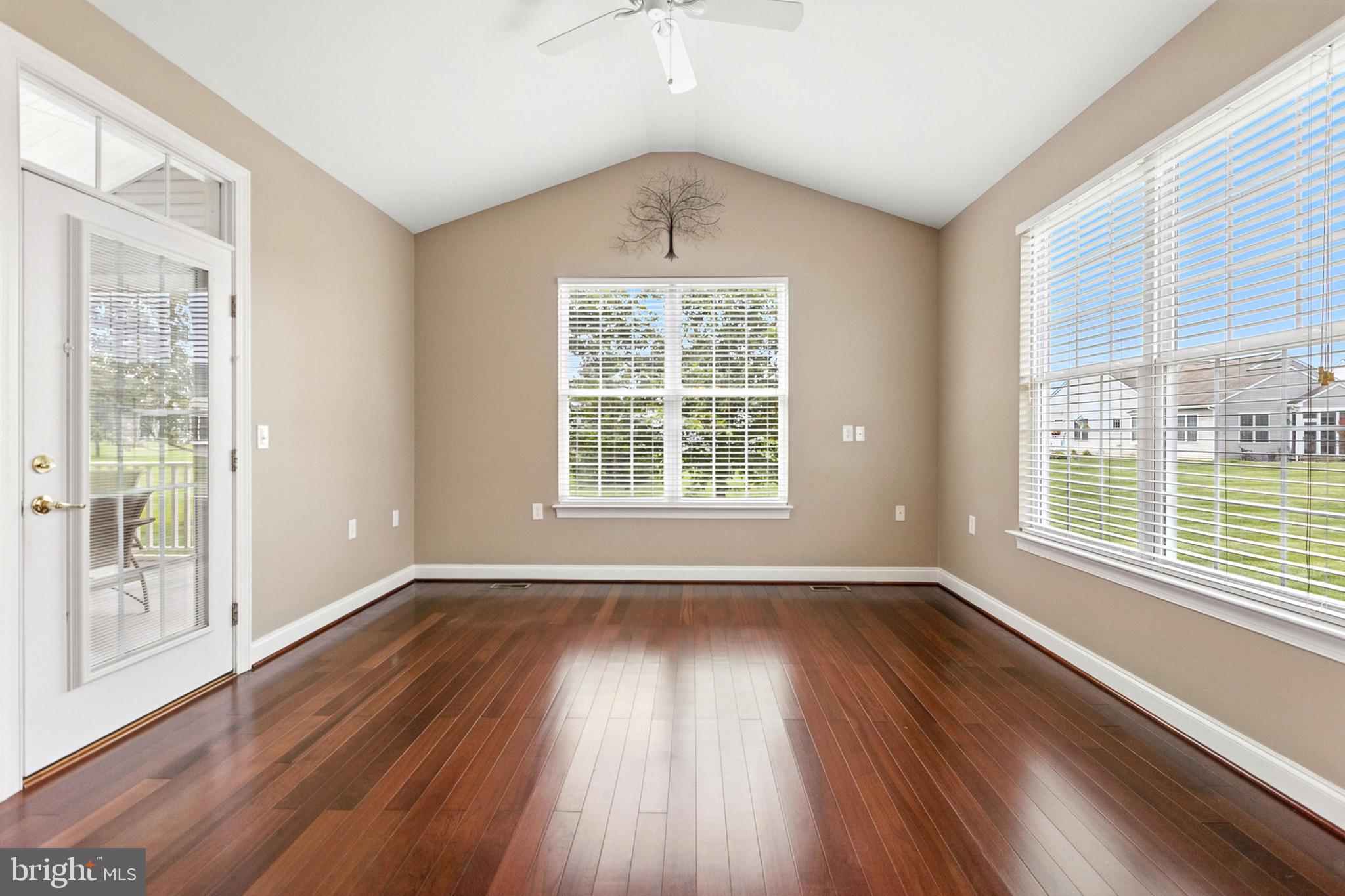 8 Spring Arbor Drive Middletown, DE 19709 - Photo 21 of 36 a view of an empty room with wooden floor and a window