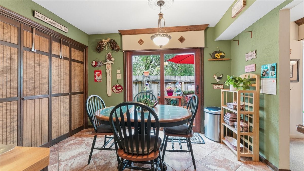 18 Still Glen Court Spring, TX 77381 - Photo 15 of 40 and for quick outdoor entertaining it is a quick step through the sliding doors to the back deck where the party will be underway.