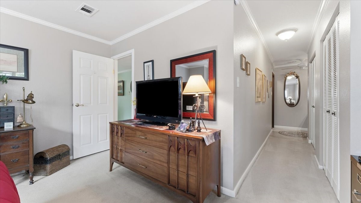 18 Still Glen Court Spring, TX 77381 - Photo 25 of 40 The Primary Bath is at the end of a hall and the room has double closets in the hall.