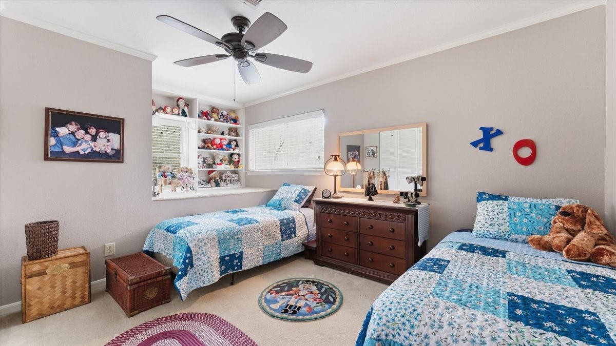 18 Still Glen Court Spring, TX 77381 - Photo 28 of 40 The last bedroom, which is opposite the others, boasts in size and splendor. This room has a nifty loft feature with bookshelves for that person that loves unique niches.