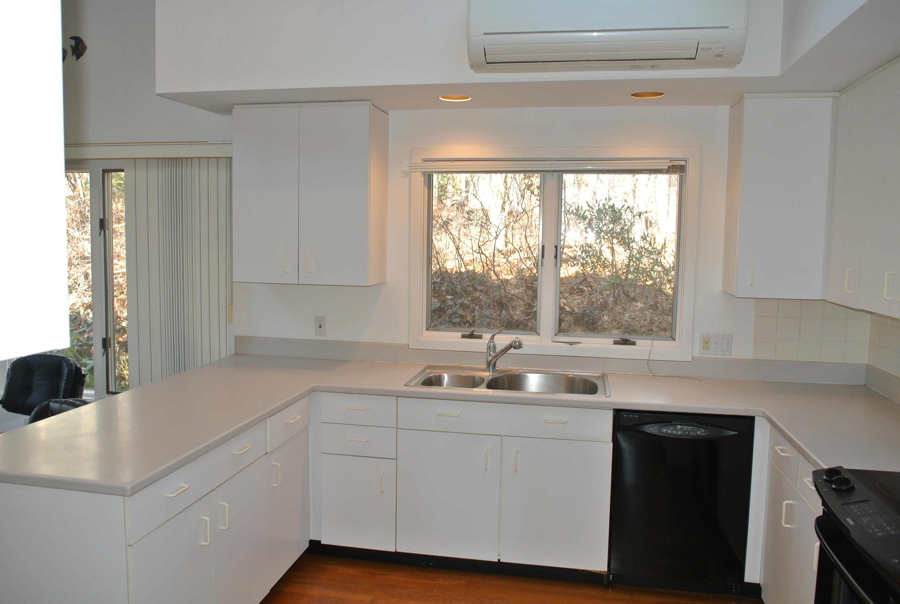 112 Fells Pond Road Mashpee, MA 02649 - Photo 3 of 23 a kitchen with a sink and large window
