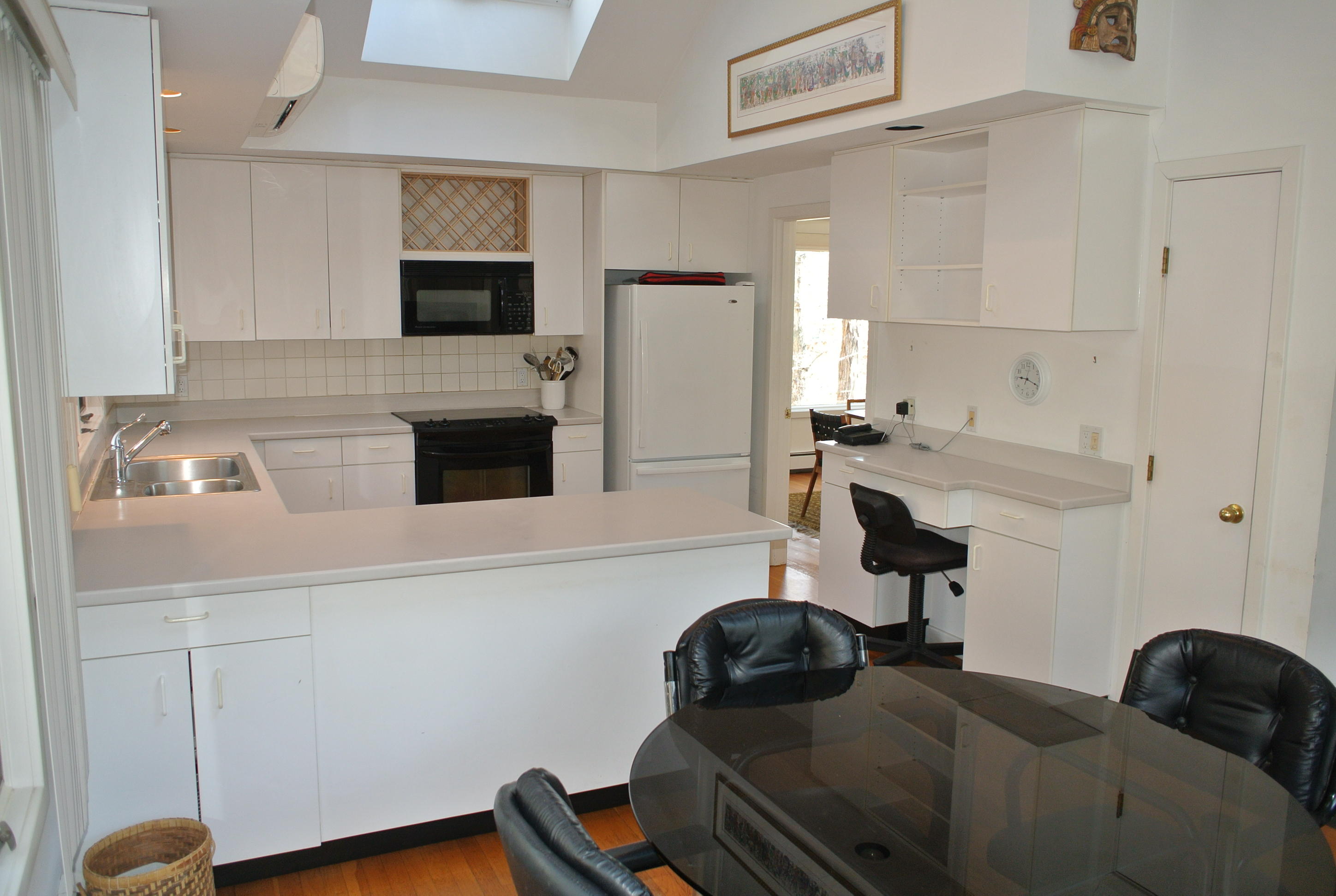112 Fells Pond Road Mashpee, MA 02649 - Photo 4 of 23 a kitchen with a refrigerator and a stove top oven
