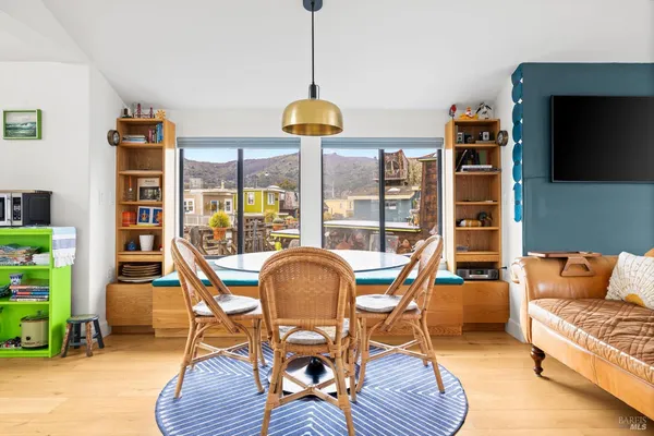 a kitchen with stainless steel appliances kitchen island granite countertop a sink a stove and a cabinets