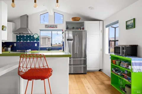 a kitchen with a sink and a stove top oven