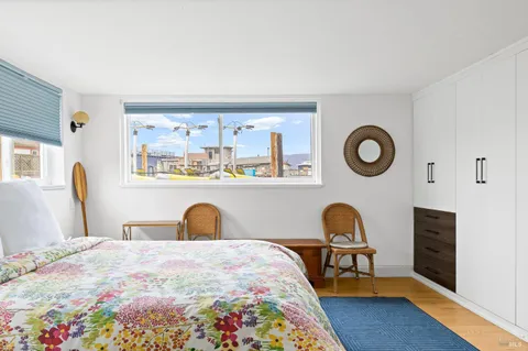 a bathroom with a tub a sink and a large mirror