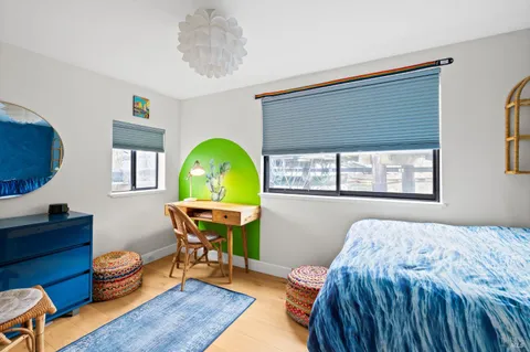 a water view with boat and palm trees