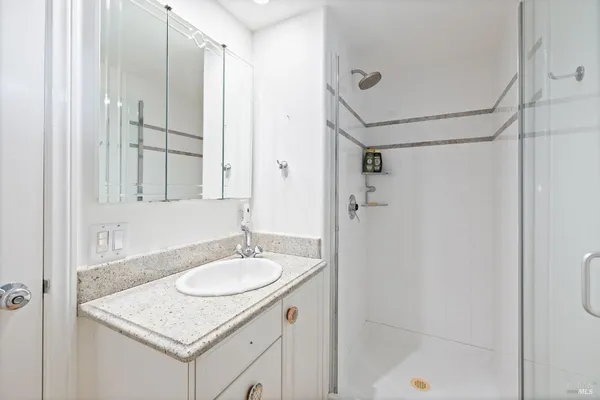 a view of a hallway with washer and dryer