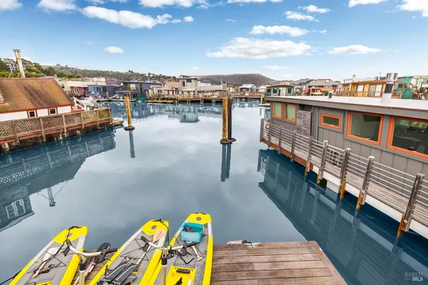 a view of a balcony with wooden benches