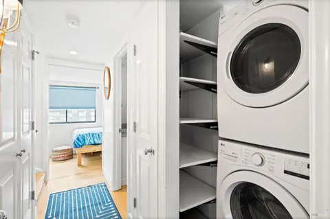 a living room with fireplace furniture and a wooden floor