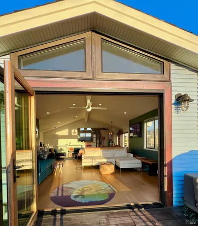 a view of a house with pool and chairs