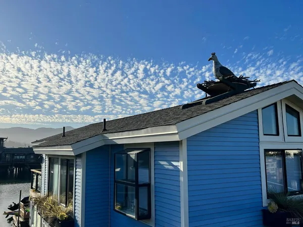a view of a balcony with chairs