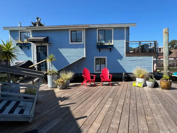 a backyard of a house with seating space