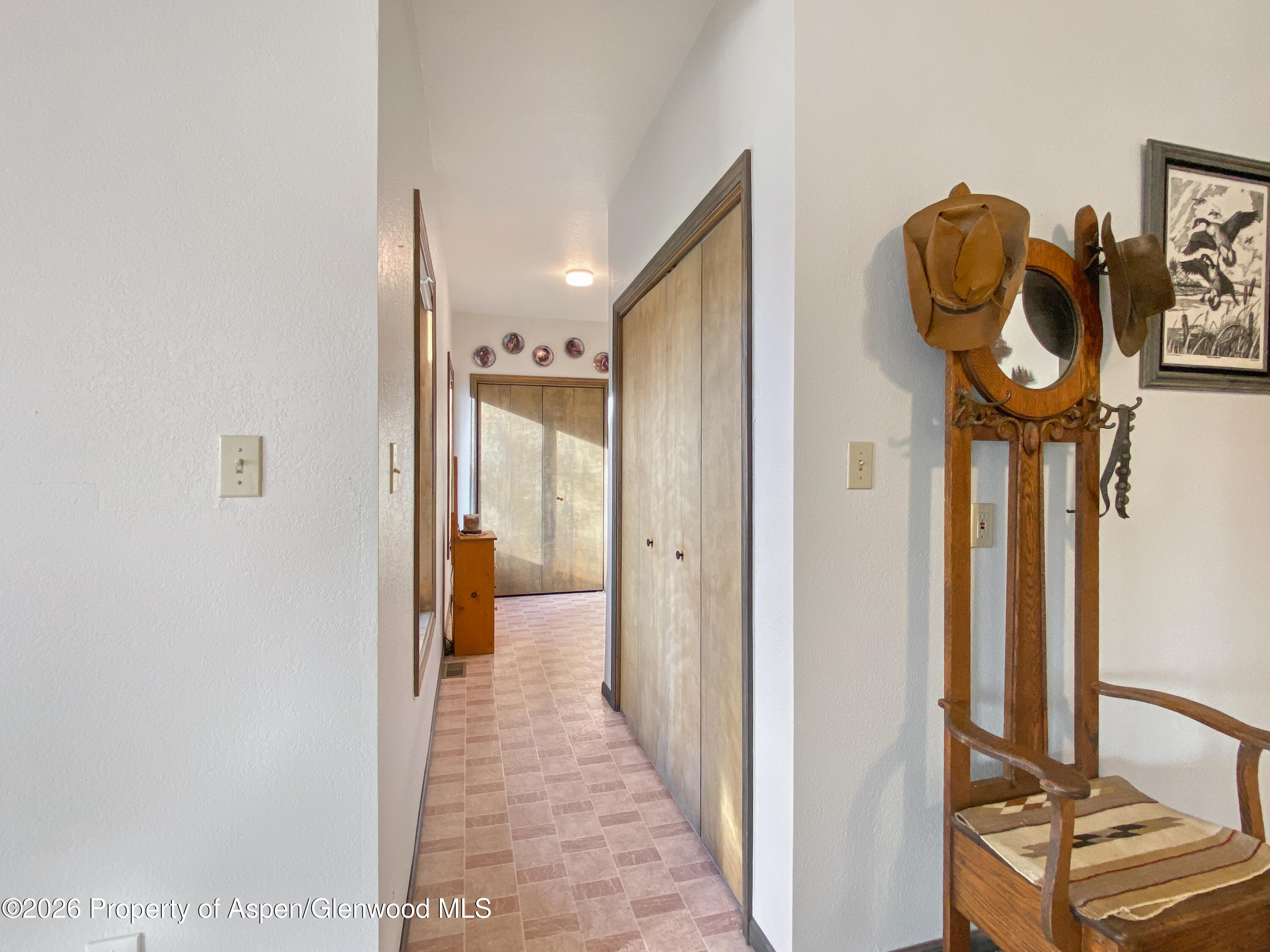 925 Cleveland Street Meeker, CO 81641 - Photo 14 of 30 Hall with laundry closet