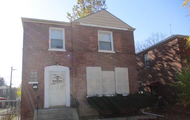 415 West 99th Place Chicago, IL 60628 - Photo 2 of 14 a front view of a house with a yard