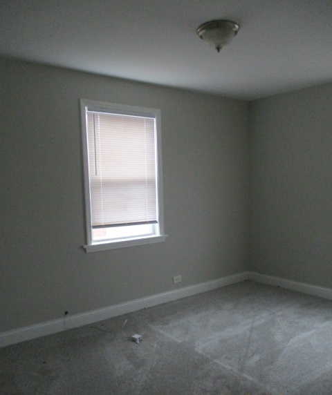 415 West 99th Place Chicago, IL 60628 - Photo 7 of 14 an empty room with a window