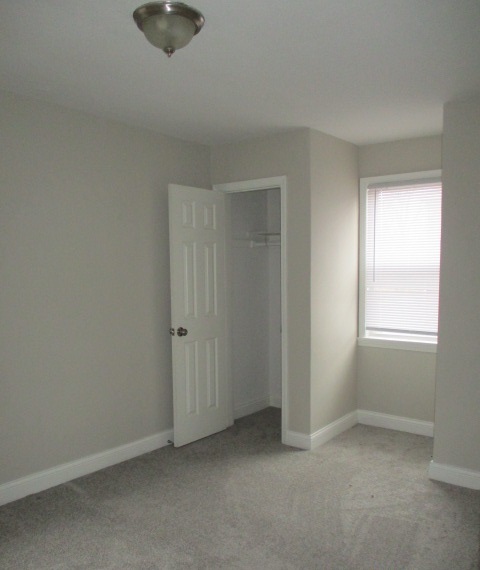 415 West 99th Place Chicago, IL 60628 - Photo 8 of 14 an empty room with a window