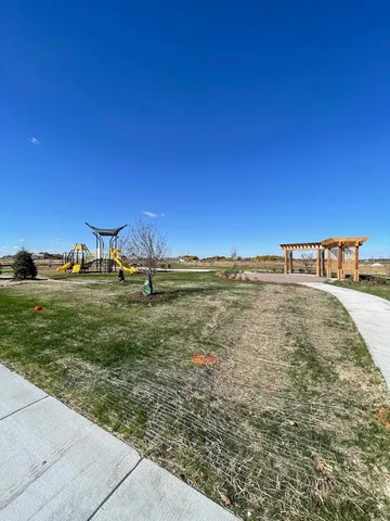 a view of a swimming pool with an outdoor space and seating area