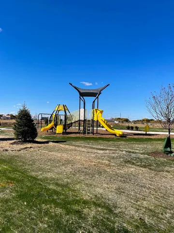 a view of a swimming pool with an outdoor space and seating area