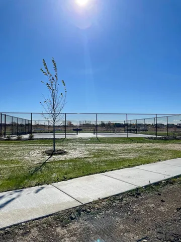 a view of a house with a yard porch and sitting area